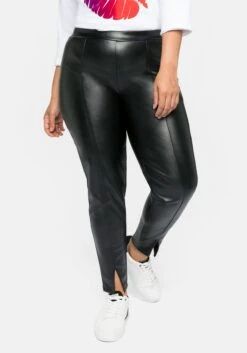 Sheego Leggings In Lederoptik, Mit Schlitz Am Saum